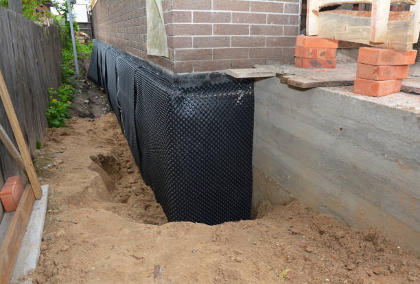 Happy homeowners after waterproofing job in Berry